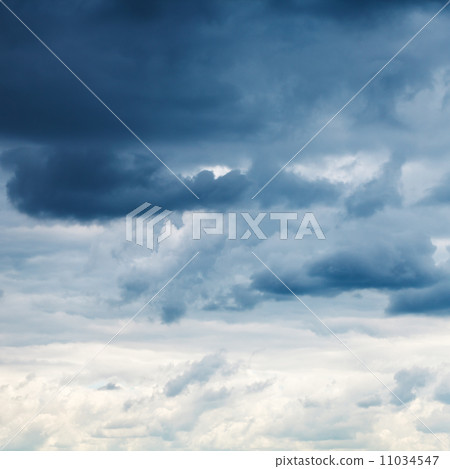 dark blue rainy clouds in overcast sky 11034547