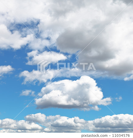 fluffy clouds in blue afternoon sky fluffy clouds in blue afternoon sky 11034576