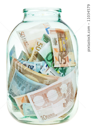 saving euro money in glass jar saving euro money in glass jar 11034579