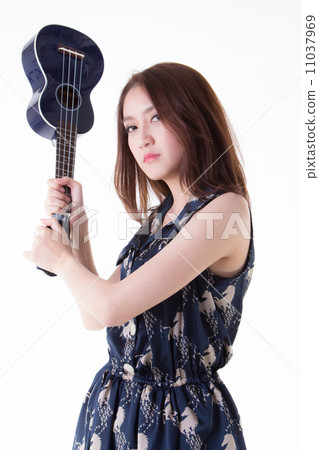 Asian woman playing ukulele 11037969
