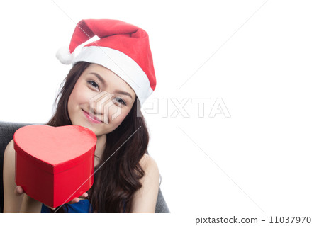 Young women wearing Christmas hats 11037970