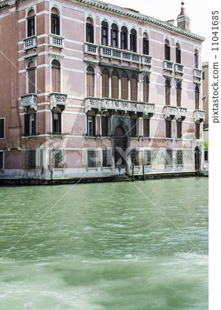 Ancient buildings and boats in the channel in Venice 11041685