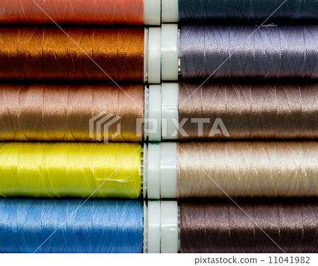 Colored spools of threads. 11041982