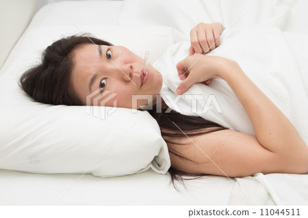 asian woman fever with thermometer 11044511