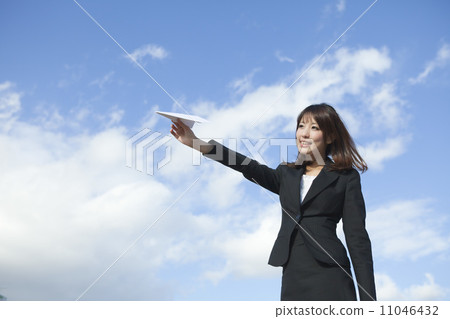 Business woman skipping paper airplane Business woman skipping paper airplane 11046432