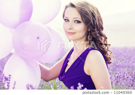 Adorable girl with purple balloons. Adorable girl with purple balloons. 11049369