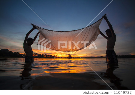 Fisherman  in action when fishing 11049722