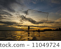 Fisherman  in action when fishing 11049724