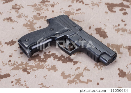 US MARINES concept with handgun on camouflage uniform US MARINES concept with handgun on camouflage uniform 11050684