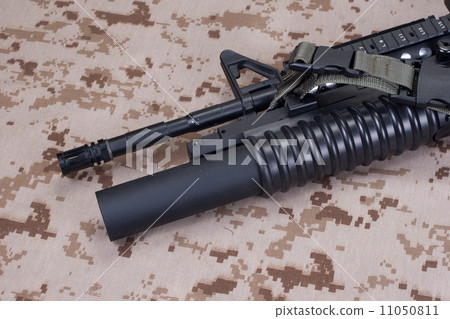 m4 carbine on camouflage uniform 11050811