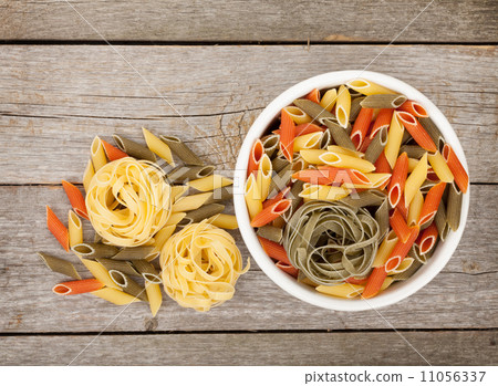 Pasta on wooden table Pasta on wooden table 11056337