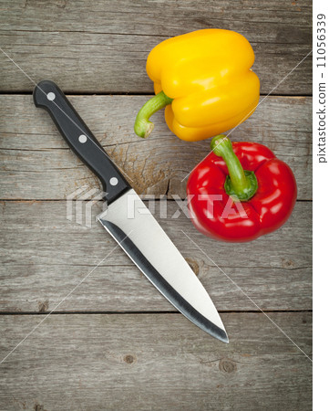 Colorful bell peppers and kitchen knife 11056339