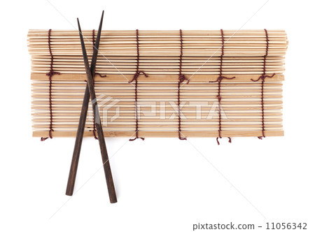 Chopsticks over bamboo mat 11056342