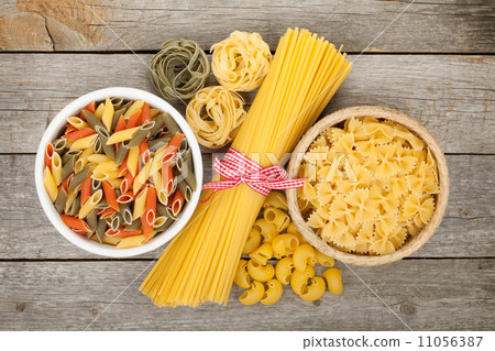 Pasta on wooden table 11056387