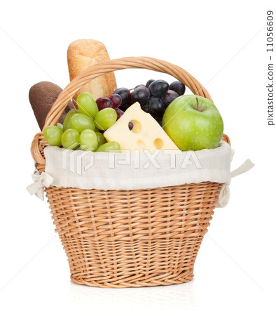 Picnic basket with bread and fruits Picnic basket with bread and fruits 11056609