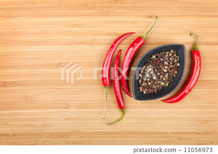 Red hot peppers and peppercorn 11056973