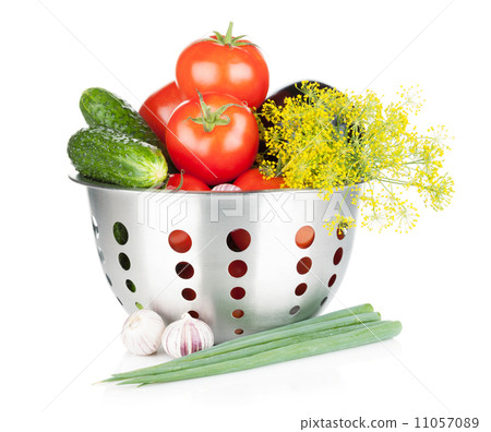 Fresh ripe vegetables in colander 11057089