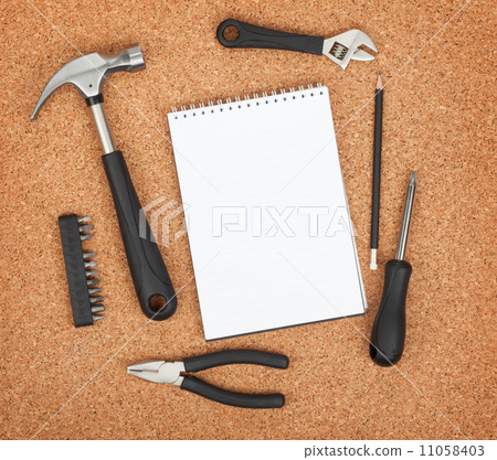 Set of tools on cork background Set of tools on cork background 11058403