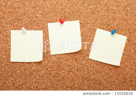 Blank postit notes on cork notice board Blank postit notes on cork notice board 11058838