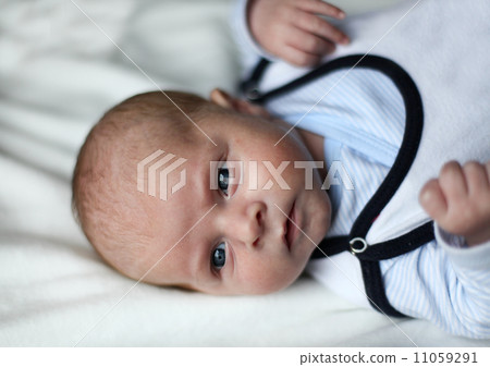 Newborn baby boy with blue eyes Newborn baby boy with blue eyes 11059291