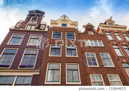 Living houses facades with blue sky. Amsterdam, Netherlands 11064625