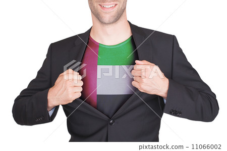 Businessman opening suit to reveal shirt with flag 11066002