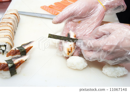 Japanese chef preparing a meal in a restaurant 11067148