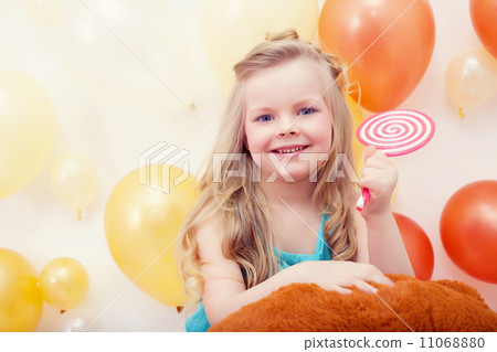 Portrait of funny little model with lollipop Portrait of funny little model with lollipop 11068880