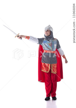 Smiling boy posing dressed as knight with sword Smiling boy posing dressed as knight with sword 11068894