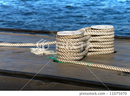 Modern military submarine fragment:careful bundle of rope on the mooring bollard 11075070