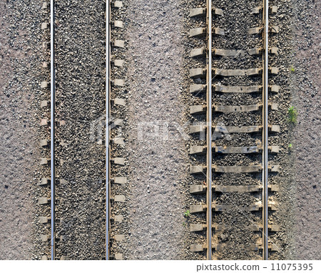 Detailed industrial background texture of railway tracks on gravel Detailed industrial background texture of railway tracks on gravel 11075395