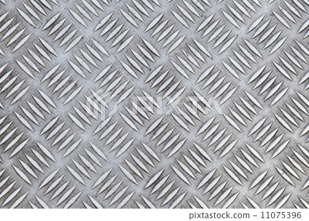 Closeup texture of diamond metal plate with details Closeup texture of diamond metal plate with details 11075396