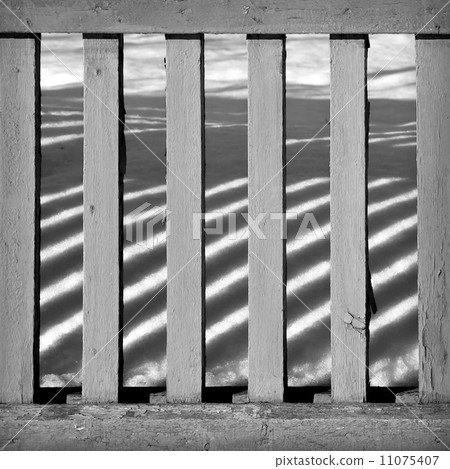 Abstract pattern with wooden fence with sunbeams 11075407
