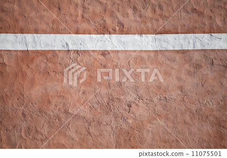 Closeup red painted stone wall texture with red plaster and white stripe 11075501