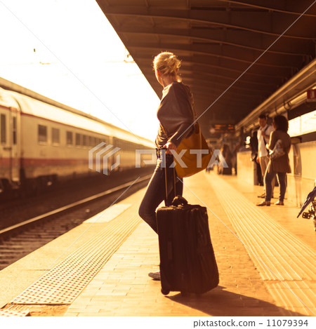 Lady waiting at the railway station. Lady waiting at the railway station. 11079394