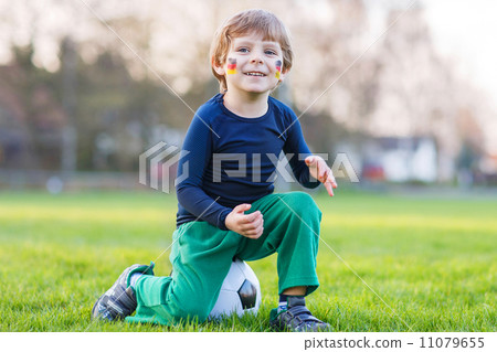 Little fan boy at public viewing of soccer or football game 11079655