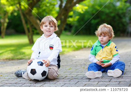 Two little fan boys at public viewing of football game Two little fan boys at public viewing of football game 11079720