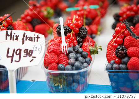 basket with fresh juicy berries on farmer market 11079753