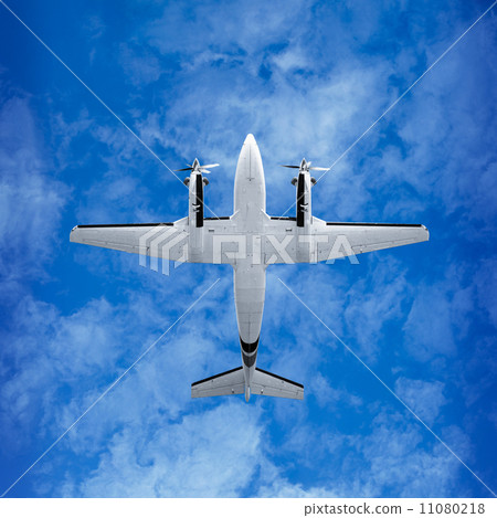 Bottom view - twin prop airplane on sky background Bottom view - twin prop airplane on sky background 11080218