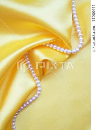Smooth elegant golden silk with pearls Smooth elegant golden silk with pearls 11080651