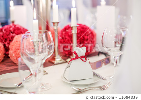 Elegant table set  for wedding or event party in soft red and pi 11084839