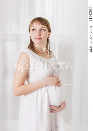 pregnant woman caressing her belly 11085664