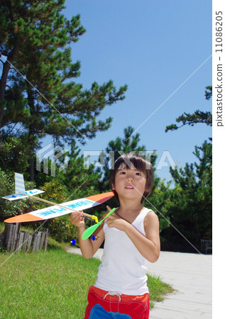 A child trying to fly a model plane A child trying to fly a model plane 11086205
