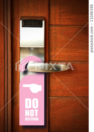 Do not disturb sign hang on door knob Do not disturb sign hang on door knob 11086386