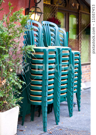 Stacked green plastic chairs Stacked green plastic chairs 11087453