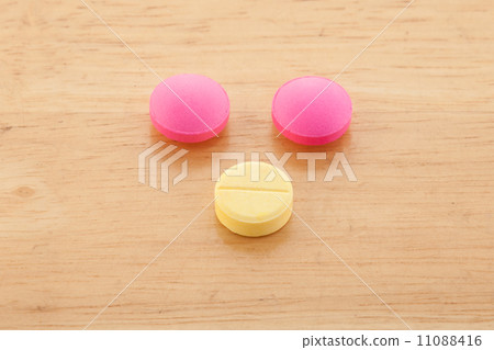 many colorful pills on a white background. symbolic photo for medicine and drugs many colorful pills on a white background. symbolic photo for medicine and drugs 11088416