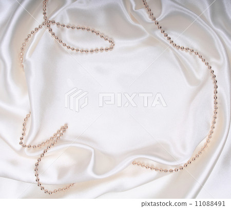 New Year's tinsel on white silk New Year's tinsel on white silk 11088491
