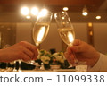 Bride and groom at reception, a toast 11099338