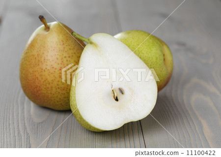 forelle pears with half on wood table forelle pears with half on wood table 11100422