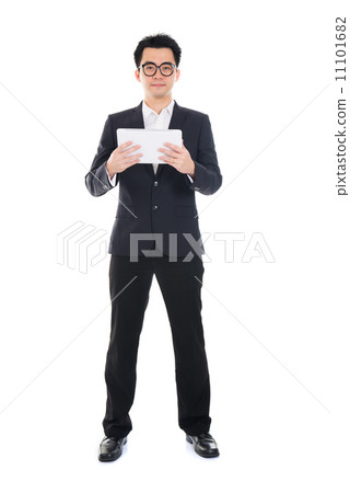 asian businessman using computer tablet full body isolated asian businessman using computer tablet full body isolated 11101682